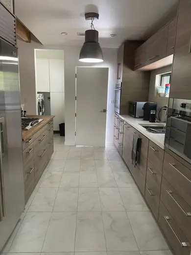 Modern kitchen with sleek cabinetry at Harlow House Sober Living, a sober living home in Los Angeles.